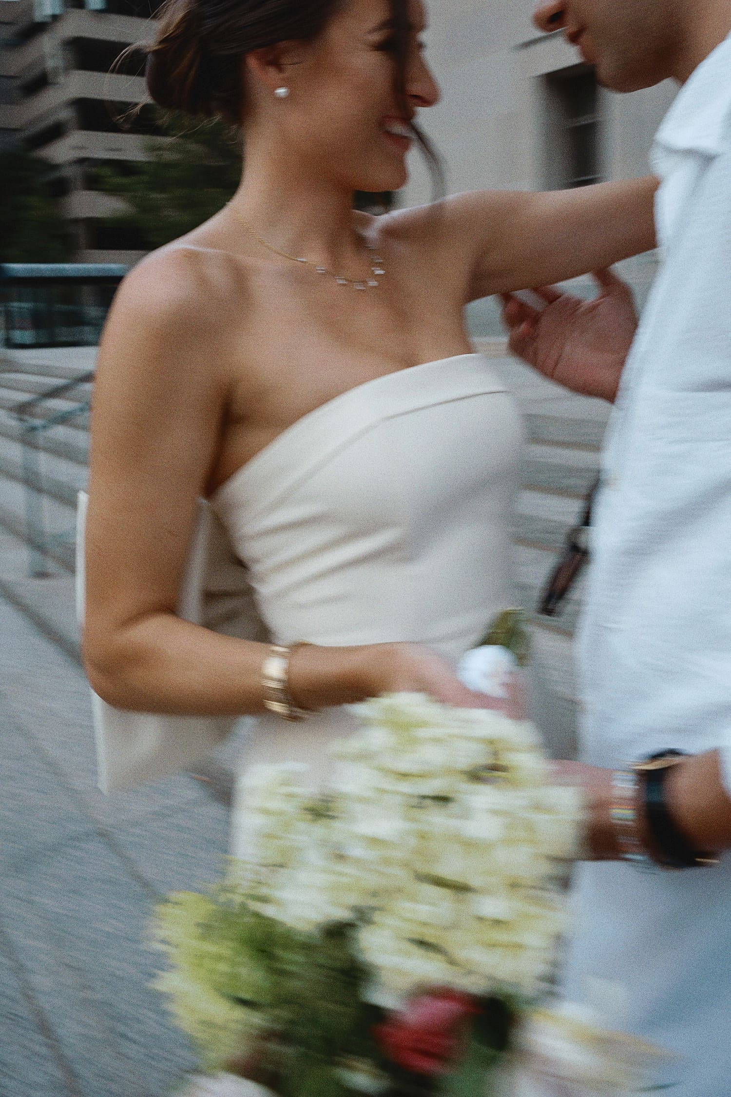 couple move together in front of courthouse by St. Louis Wedding Photographer
