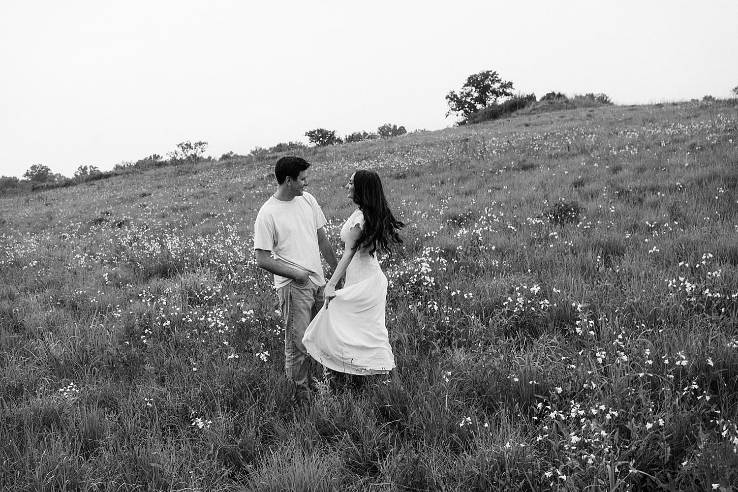 man and woman spin together in love by St. Louis wedding photographer