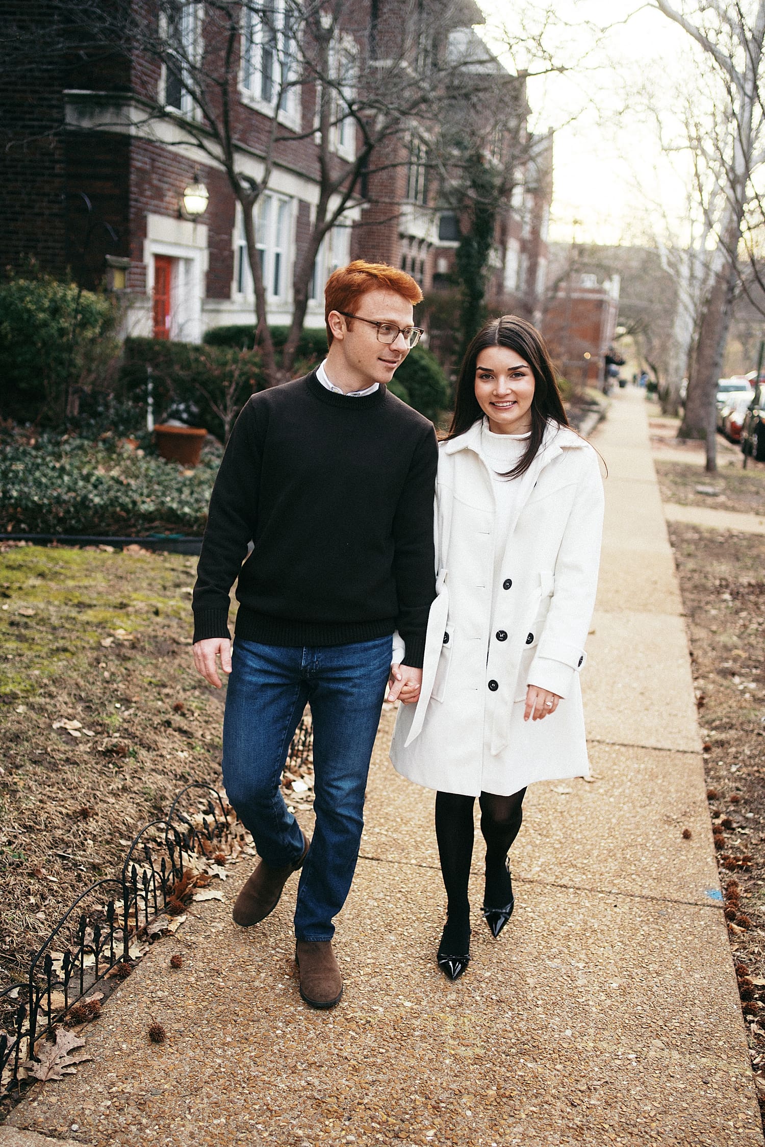 man and woman walk down neighborhood sidewalk by Camille Meers Photography