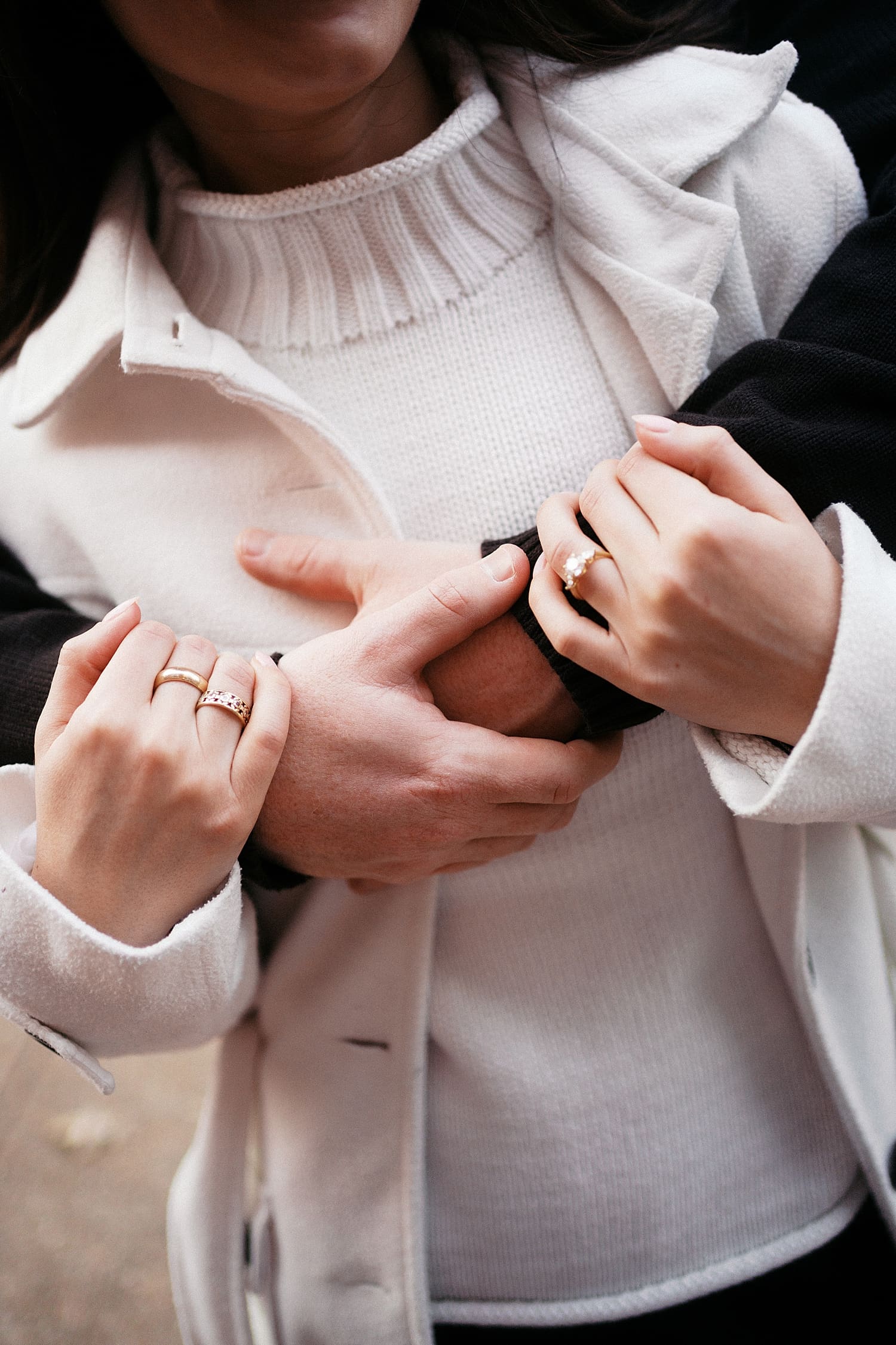 man and woman embrace on sidewalk by St. Louis Wedding Photographer