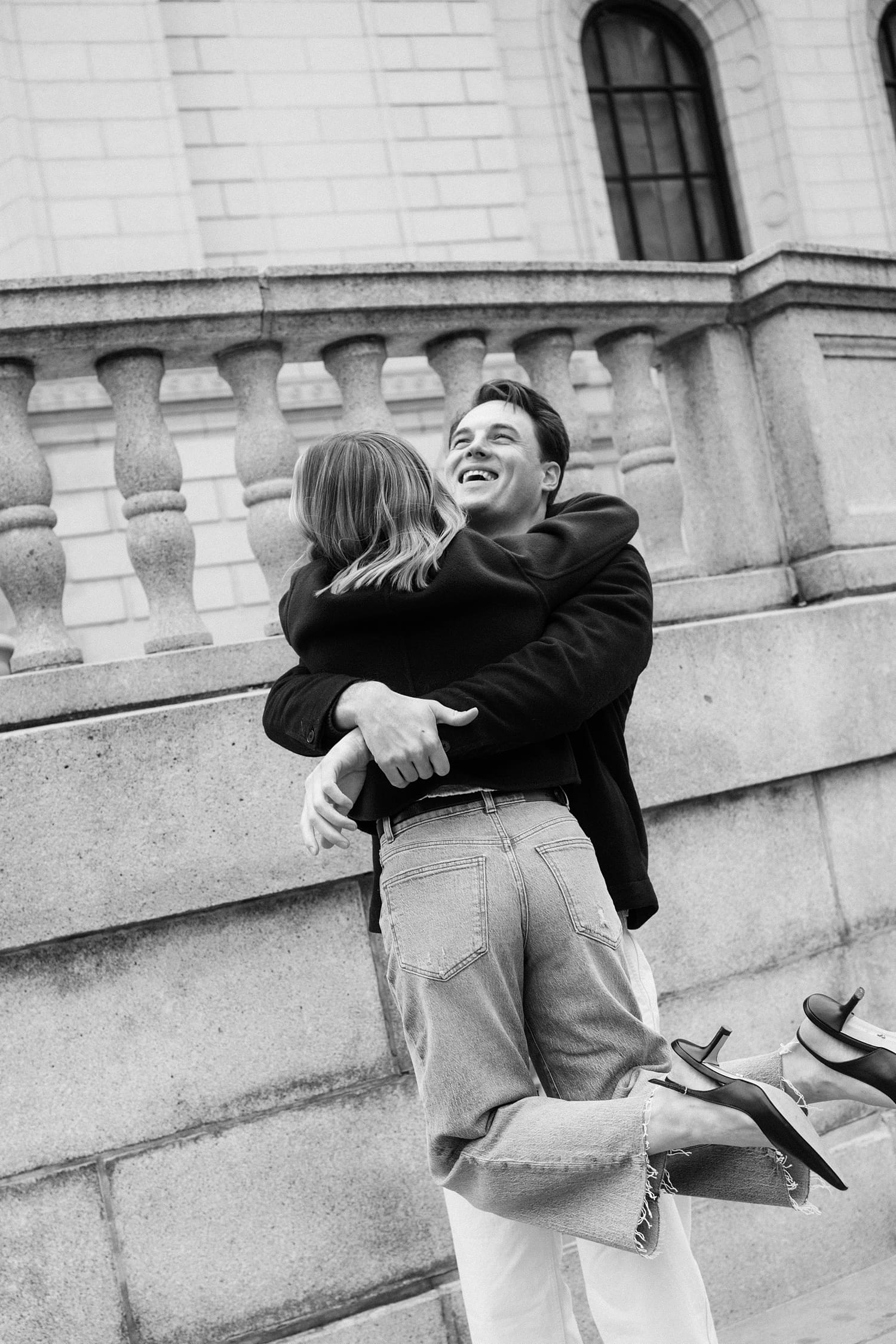 groom spins his bride-to-be around by Camille Meers Photography