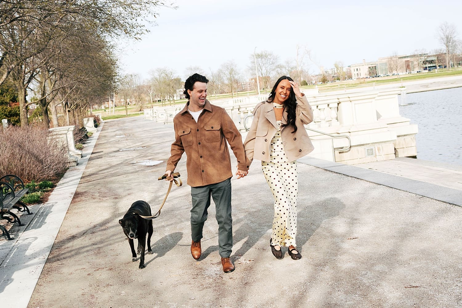 brunette bride-to-be laughs in Forest Park with her partner by Camille Meers Photography