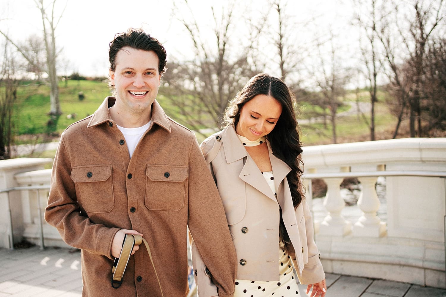 man and woman walk hand in hand through Forest Park by Camille Meers Photography