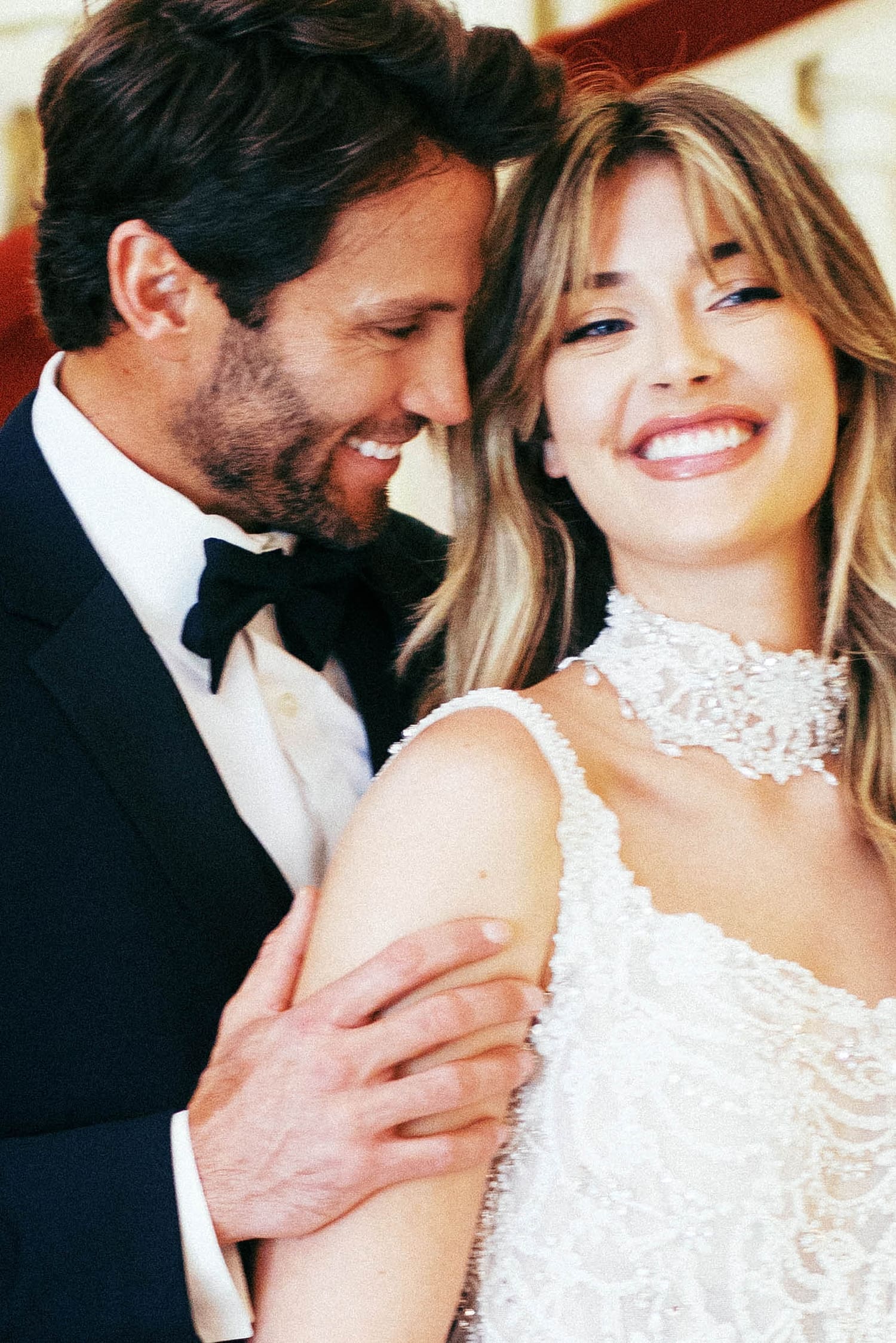 husband and wife laugh together on wedding day at Powell Hall
