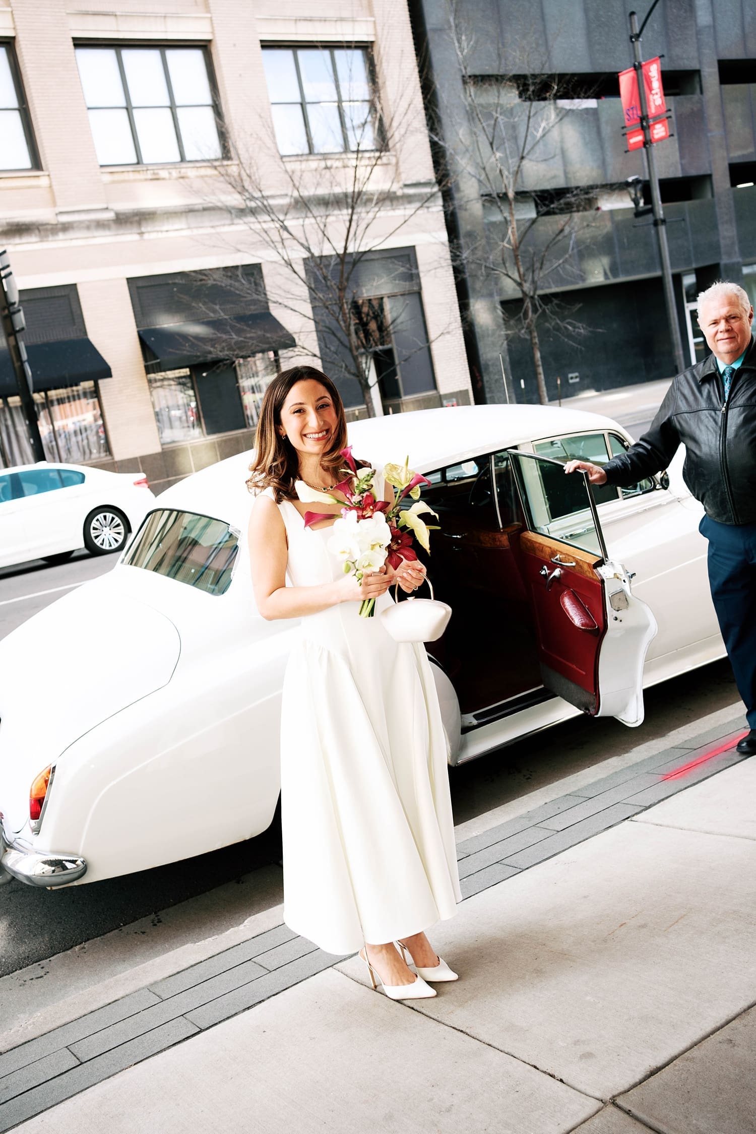 bride arrives in a rolls royce by St. Louis Wedding Photographer