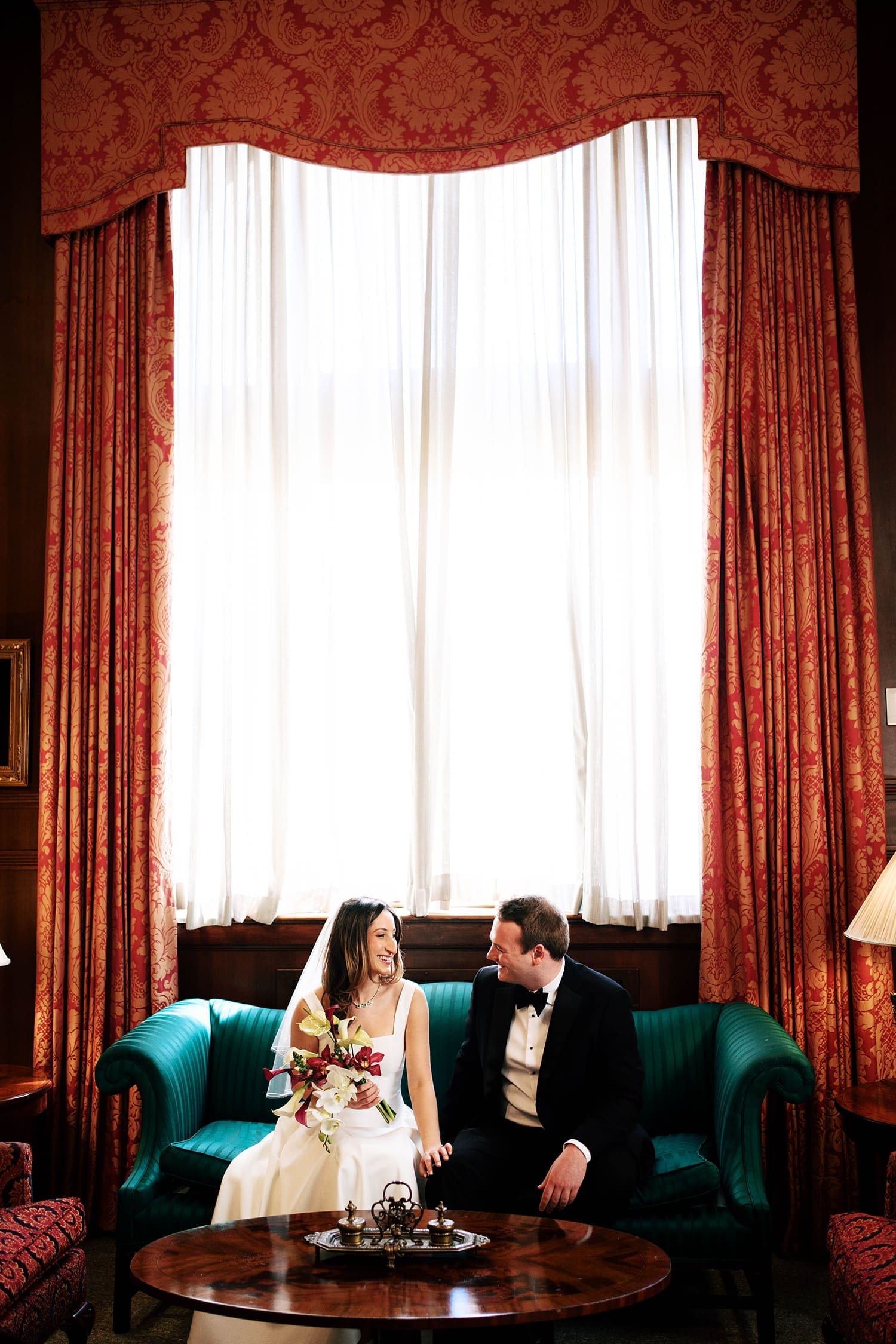 couple sit together on couch at the Missouri Athletic Club