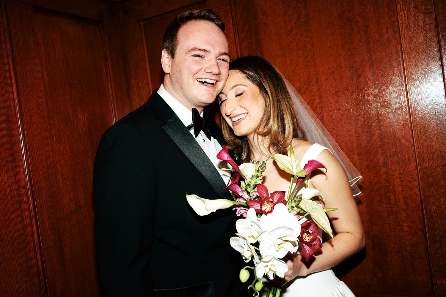 woman leans into her groom affectionately by Camille Meers Photography