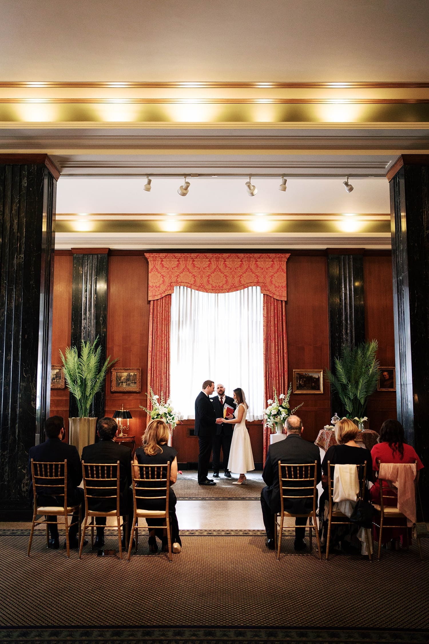 couple stand at small alter saying I Do by St. Louis Wedding Photographer
