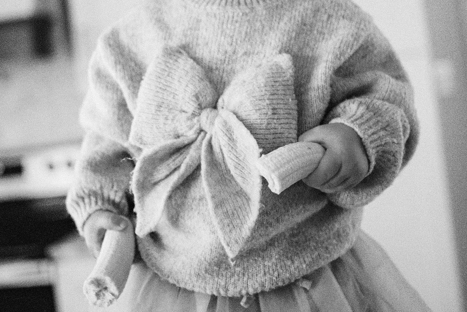 little toddler holds a banana by St. Louis film photographer