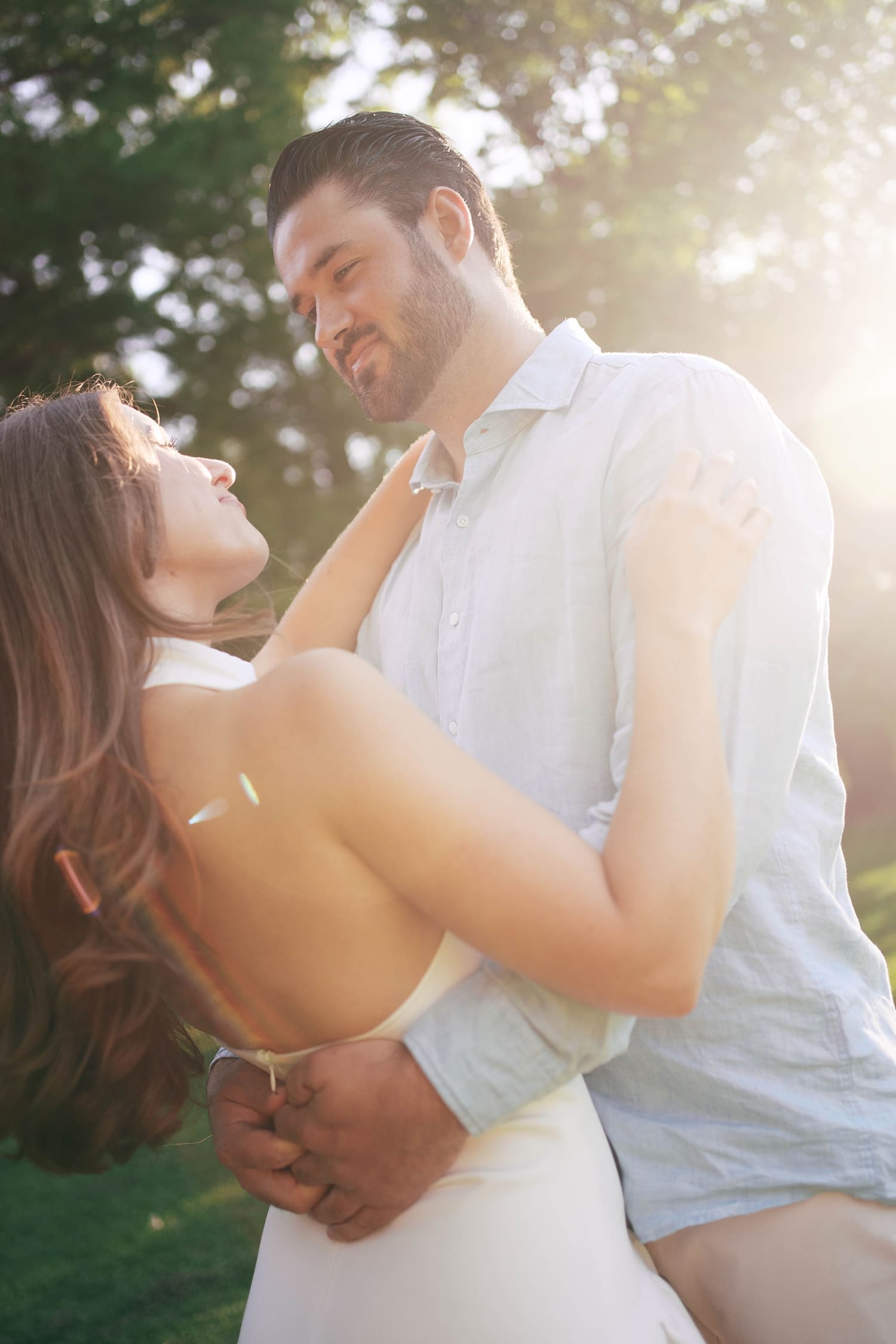 two people spin in golden hour lighting for unposed engagement session