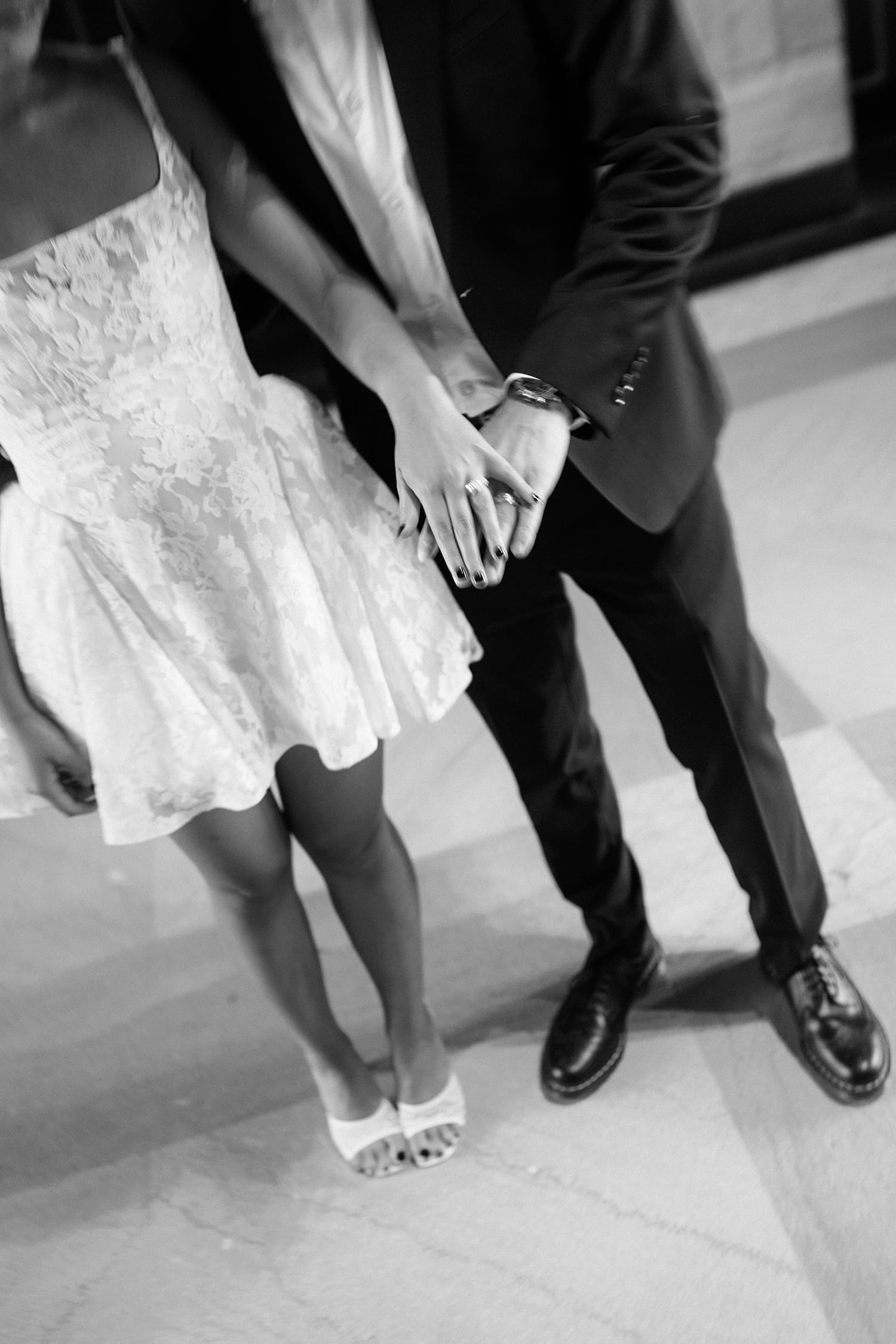 man and woman hold hands after saying I Do at the St. Louis Courthouse