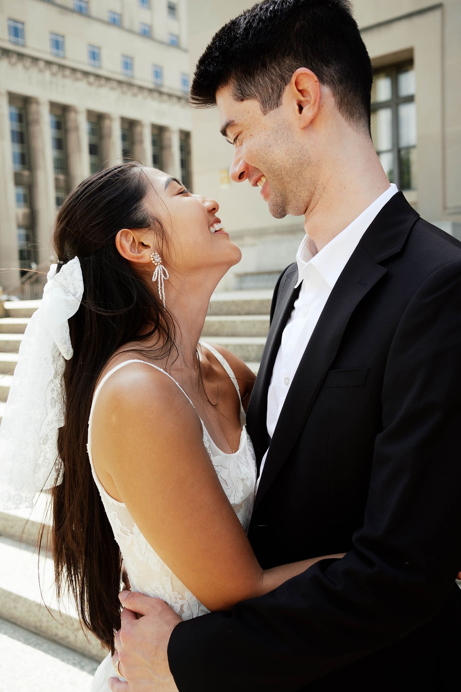 man gazes lovingly at his new wife by Missouri elopement photographer