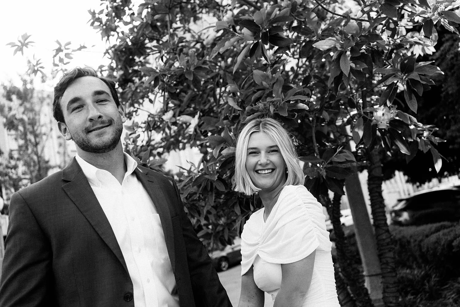 bride-to-be with short hair giggles next to her fiance by St. Louis wedding photographer